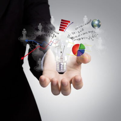 Light bulb in hand with graph out